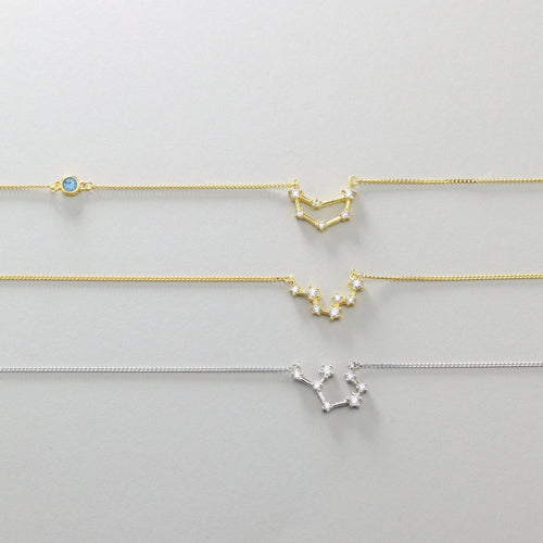 Three zodiac constellation necklaces showing finish and stone variations
