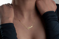 Olivia name necklace worn against the neckline
