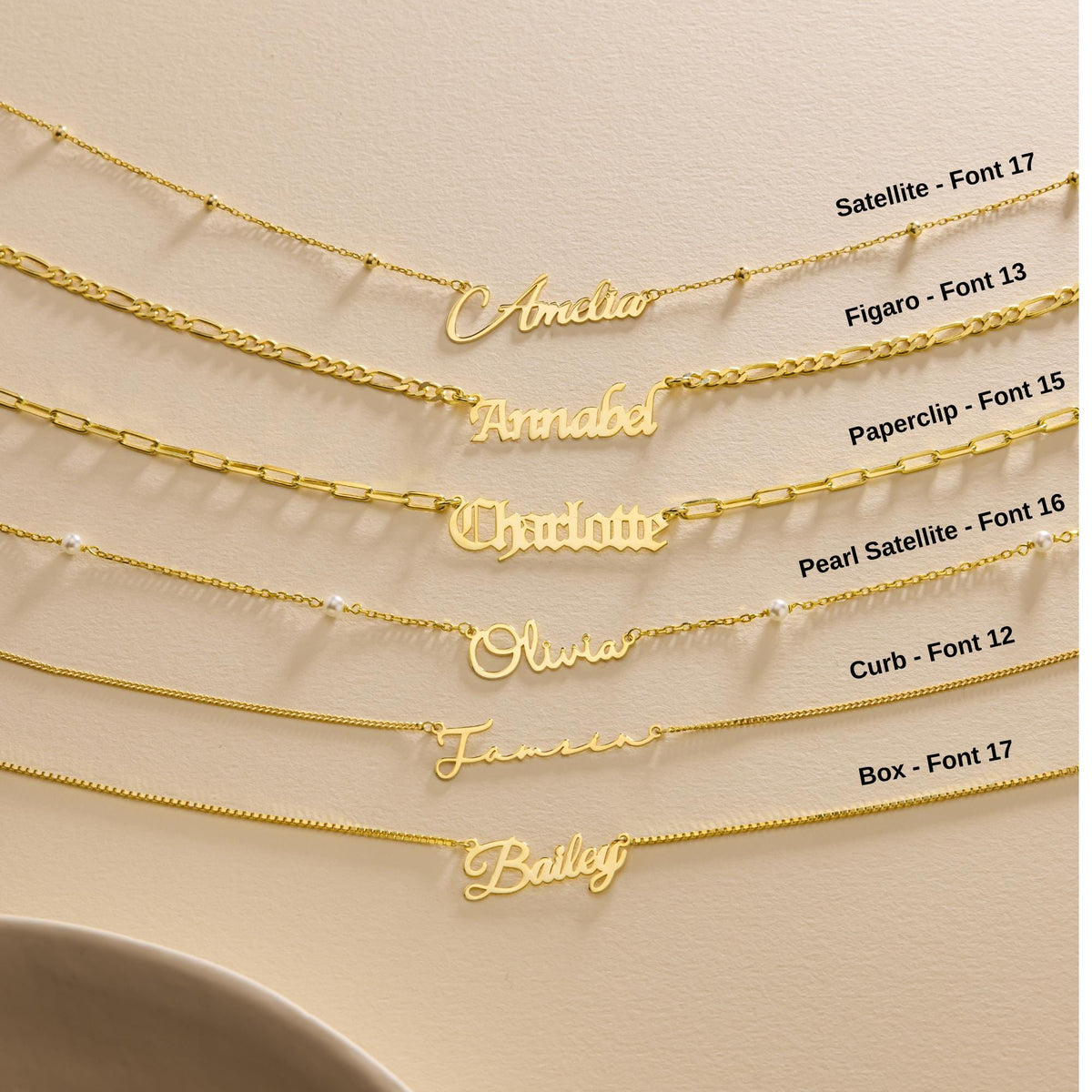 Gold-tone name necklaces with chain and font labels