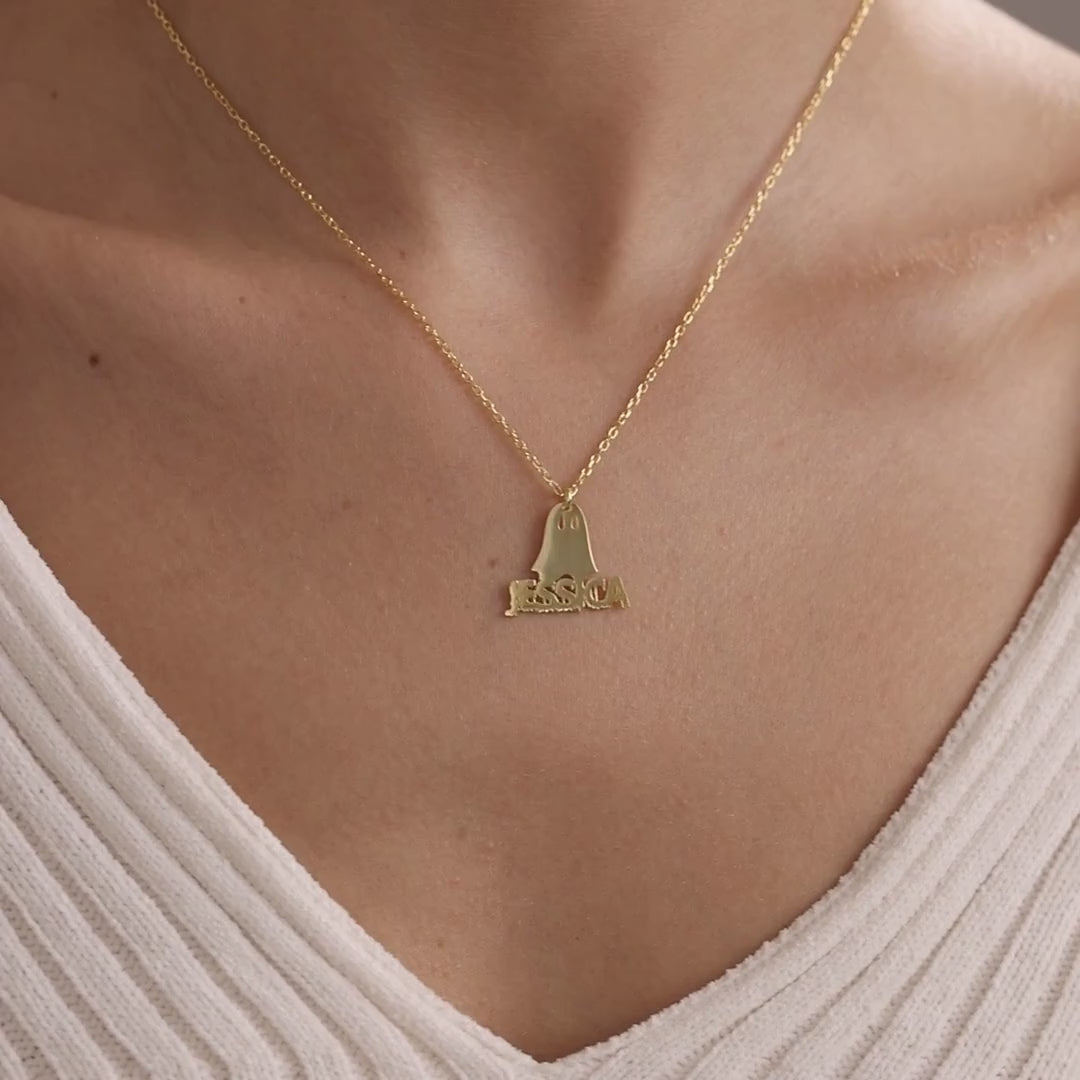 Personalised Halloween name necklaces: gold ghost and sterling silver bat worn on a model