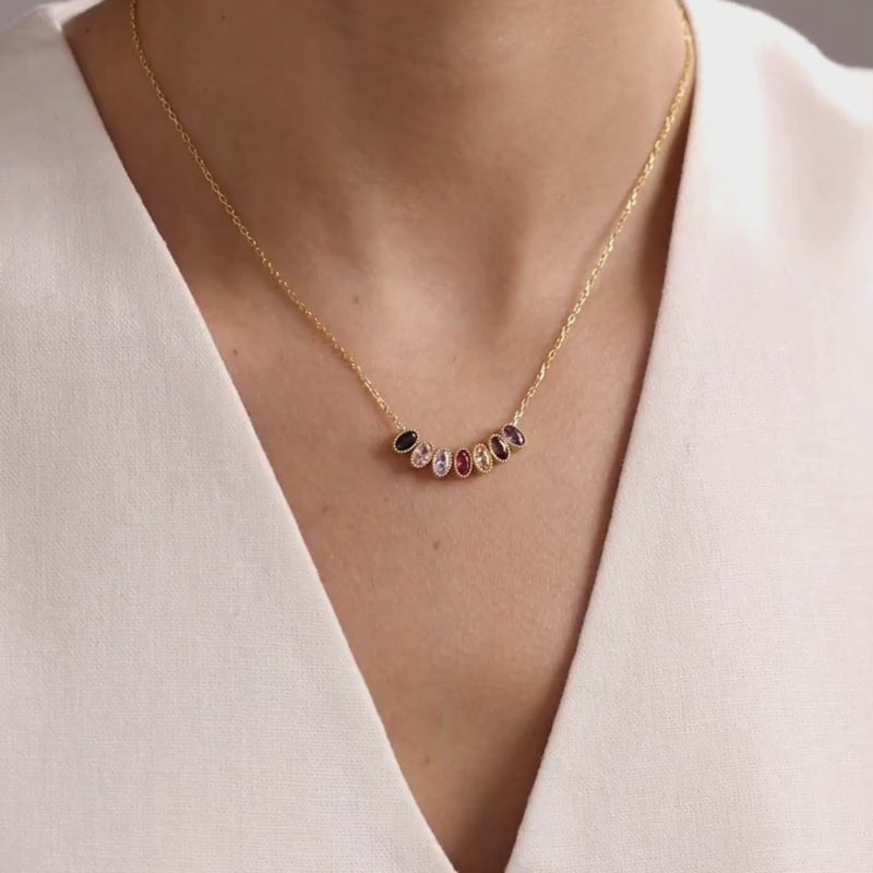 Oval family birthstone necklace in gold vermeil and sterling silver, showing natural movement and scale when worn