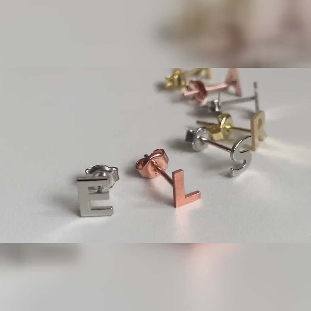 Personalised initial stud earrings in sterling silver, gold vermeil and rose gold vermeil, shown in a slower close-up